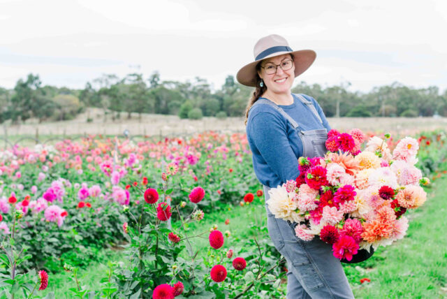 Lorelie Merton of Florelie with an armload of dahlia blooms